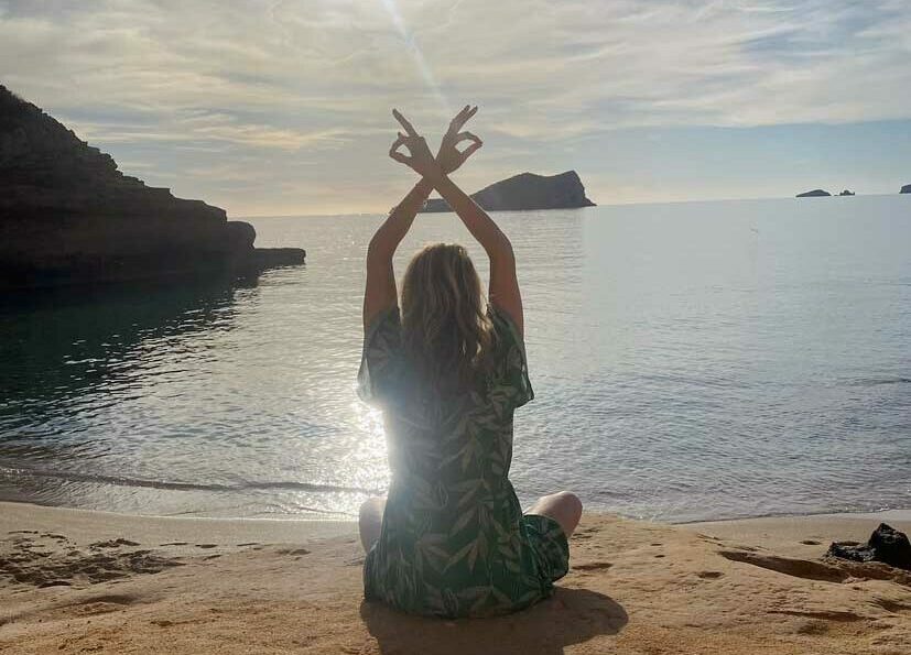 julie in yoga pose on beach